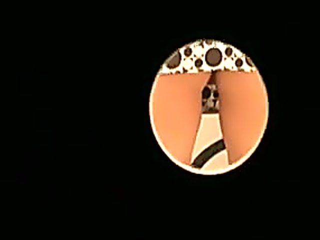 Masked slut sucks cock in a glory hole