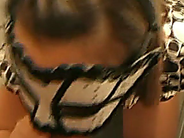 Masked slut sucks cock in a glory hole