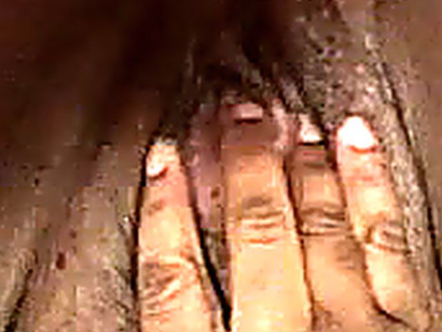 Amateur woman finger fucks her bushy meaty pussy