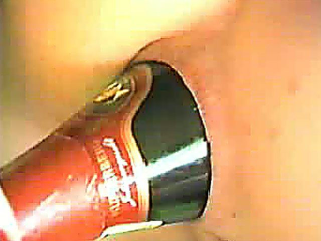 Hot chick gets a bottle in her ass