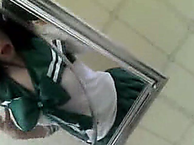 Amateur girl in sexy uniform shows her knockers