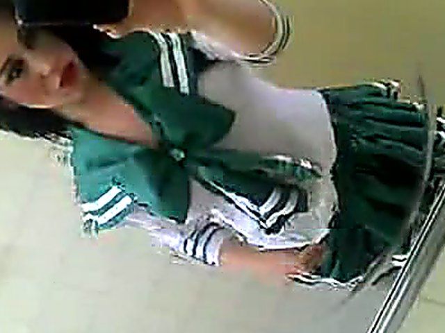 Amateur girl in sexy uniform shows her knockers