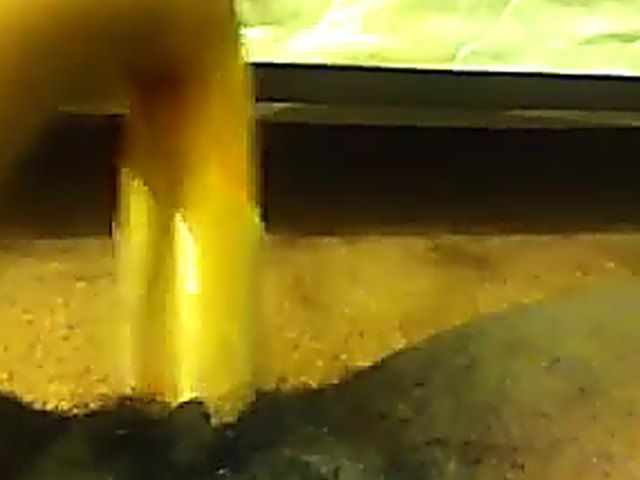 Ebony babe plays with her yellow toy