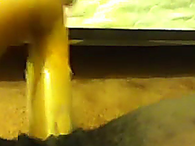 Ebony babe plays with her yellow toy