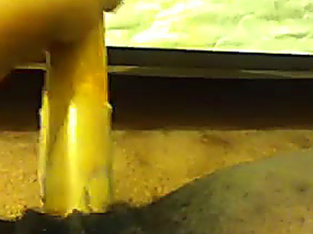 Ebony babe plays with her yellow toy