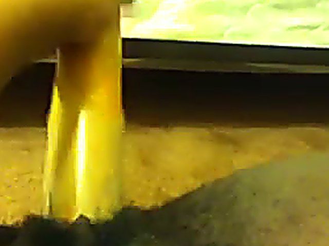 Ebony babe plays with her yellow toy