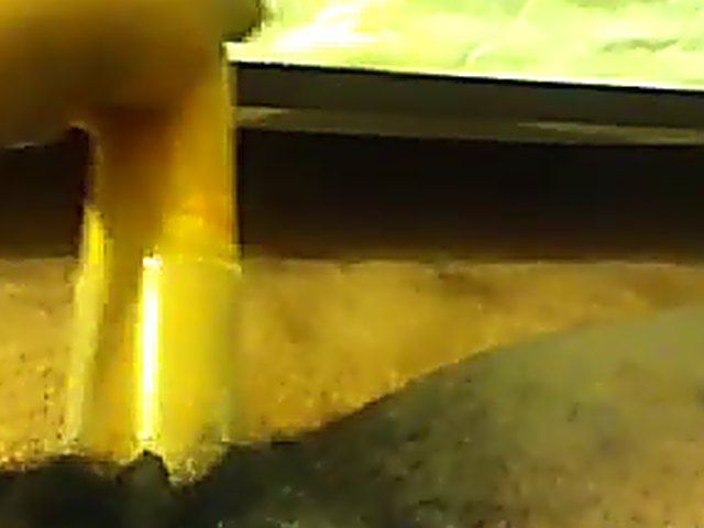 Ebony babe plays with her yellow toy