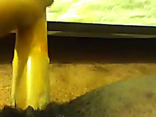 Ebony babe plays with her yellow toy