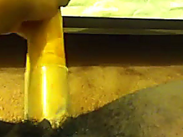 Ebony babe plays with her yellow toy