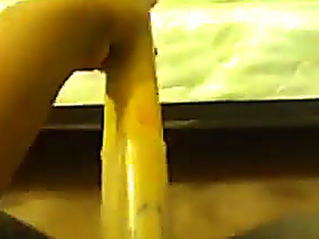 Ebony babe plays with her yellow toy