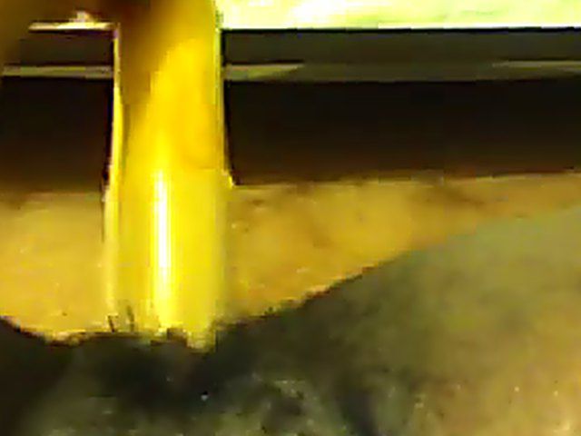 Ebony babe plays with her yellow toy