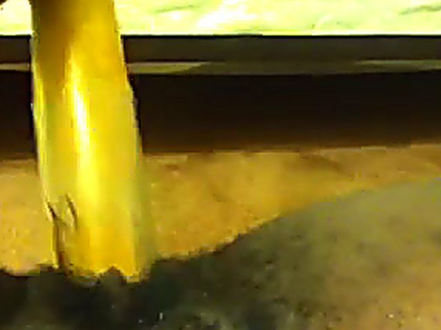 Ebony babe plays with her yellow toy