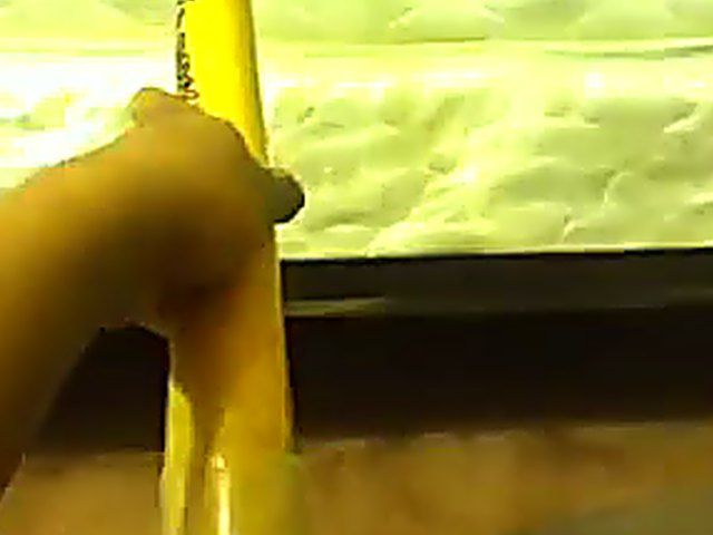 Ebony babe plays with her yellow toy