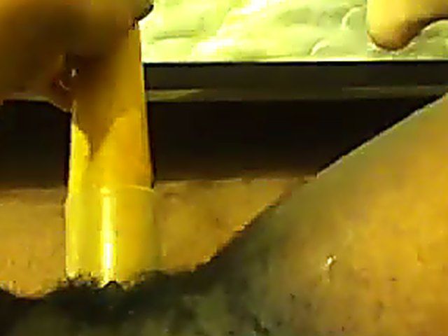 Ebony babe plays with her yellow toy