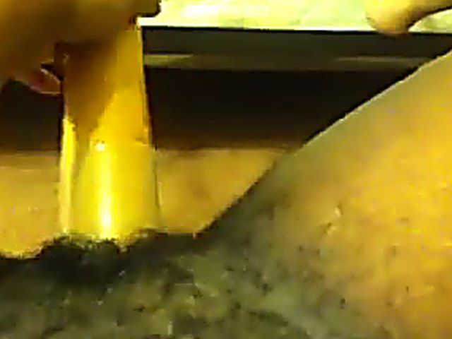 Ebony babe plays with her yellow toy