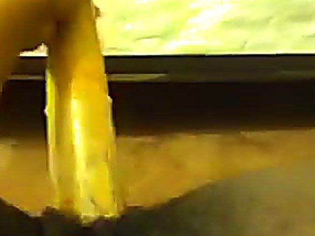 Ebony babe plays with her yellow toy