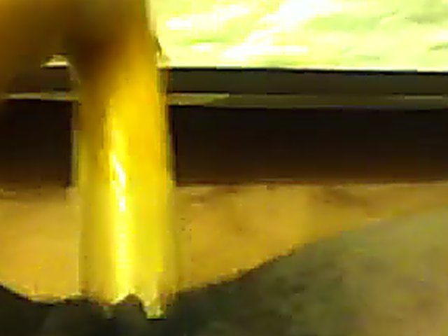 Ebony babe plays with her yellow toy