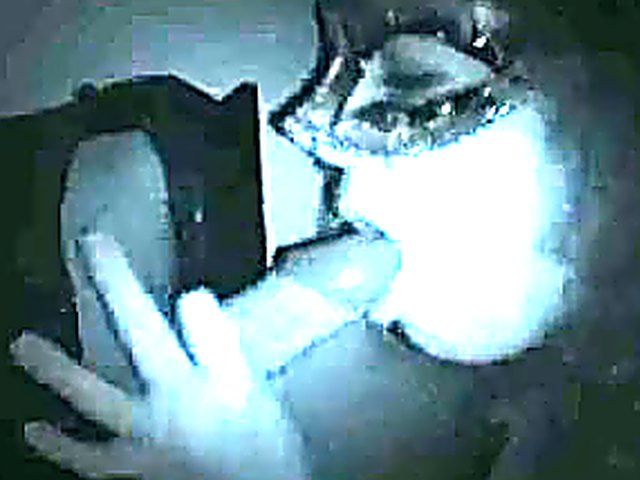 Masked babe sucks cock in a glory hole