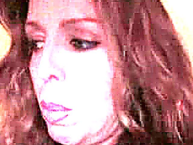 Buxom mature woman strokes her shaved snatch for cam