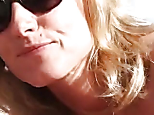 Middle aged babe fucks on the beach