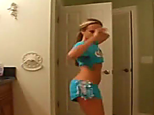 Sexy teen posses in front of the cam