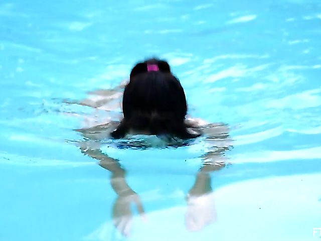 Exotic teen Melody plays with her snatch by the pool