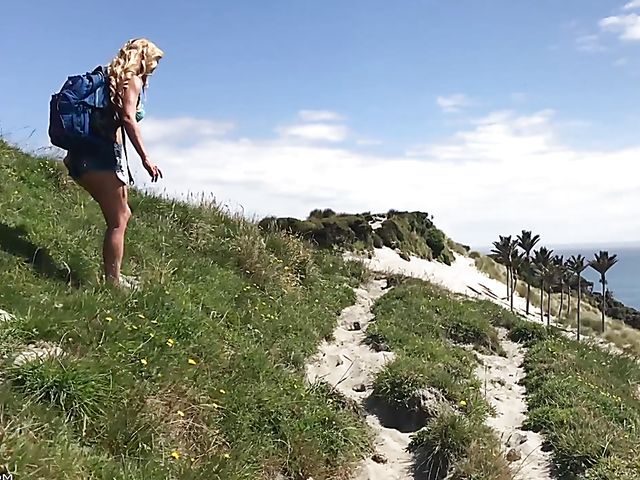 Mountain hiker Cherie DeVille wearing denim shorts