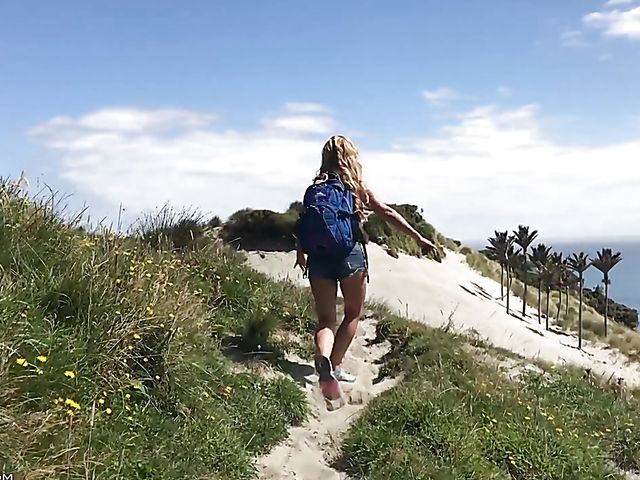 Mountain hiker Cherie DeVille wearing denim shorts