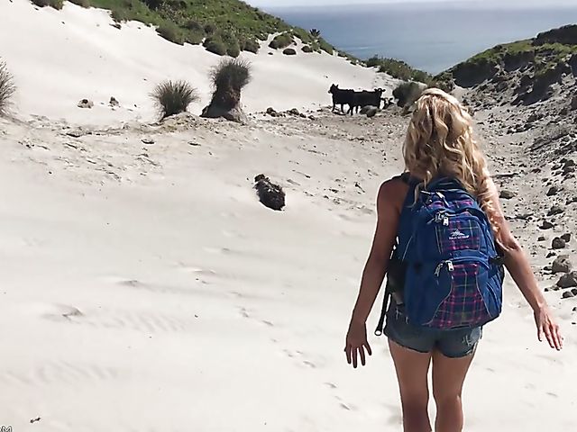 Mountain hiker Cherie DeVille wearing denim shorts