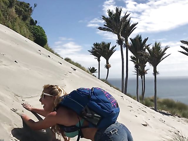 Mountain hiker Cherie DeVille wearing denim shorts