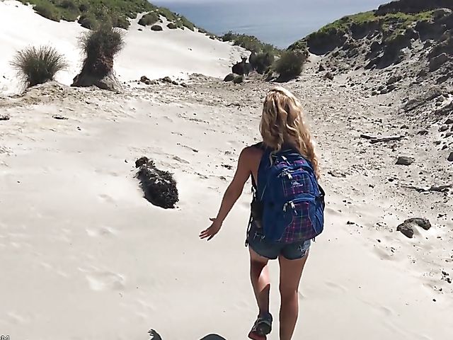 Mountain hiker Cherie DeVille wearing denim shorts