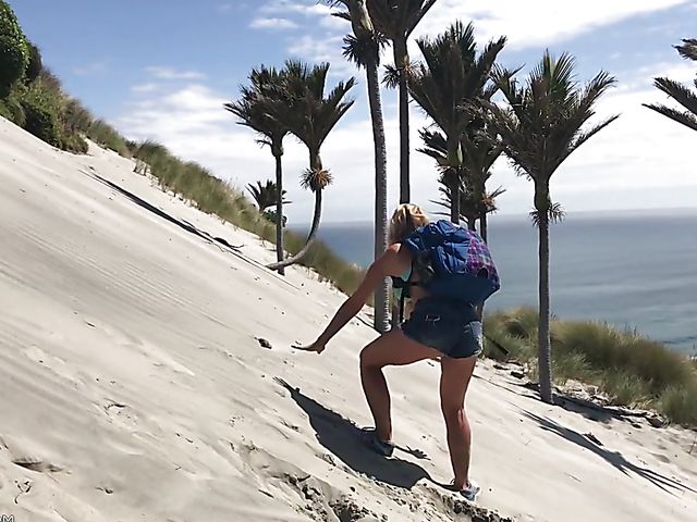 Mountain hiker Cherie DeVille wearing denim shorts