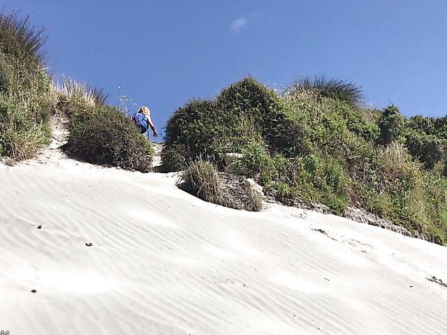 Mountain hiker Cherie DeVille wearing denim shorts