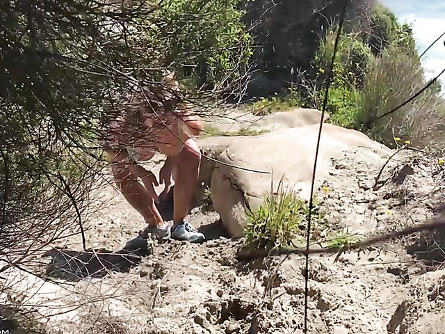 Mountain hiker Cherie DeVille wearing denim shorts