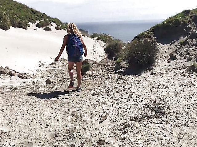 Mountain hiker Cherie DeVille wearing denim shorts