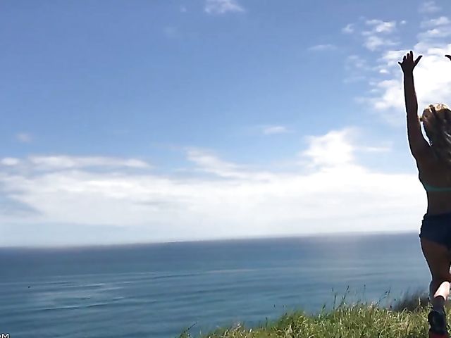 Mountain hiker Cherie DeVille wearing denim shorts