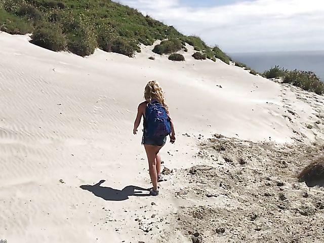 Mountain hiker Cherie DeVille wearing denim shorts