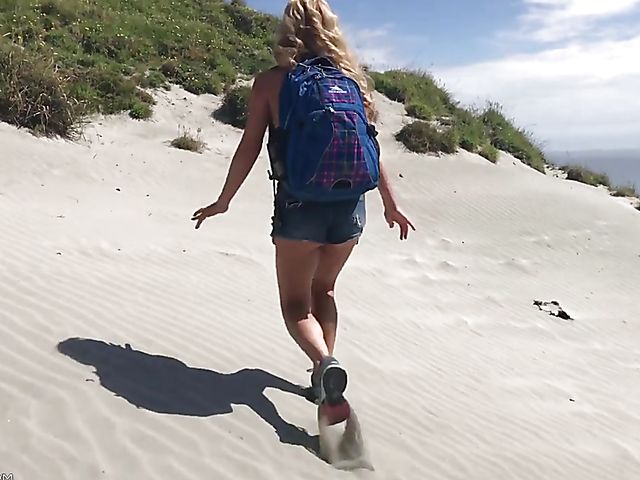 Mountain hiker Cherie DeVille wearing denim shorts