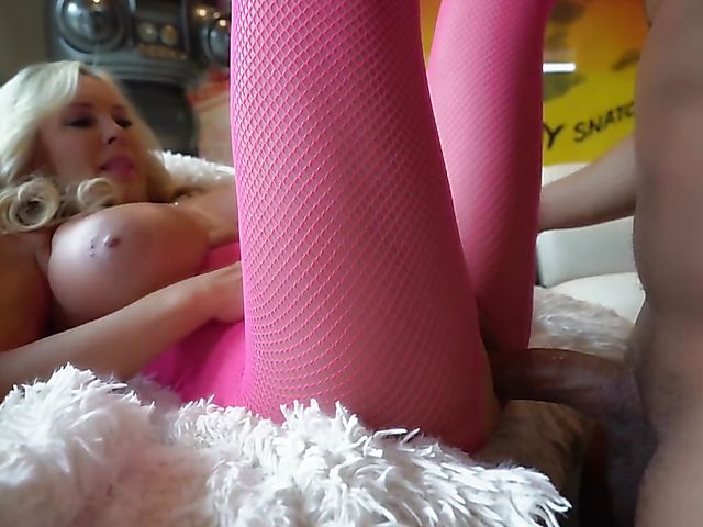 Busty wife in pink enjoys a black cock