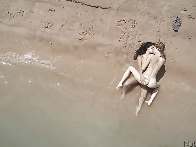 Lesbian teens do it on the wild beach