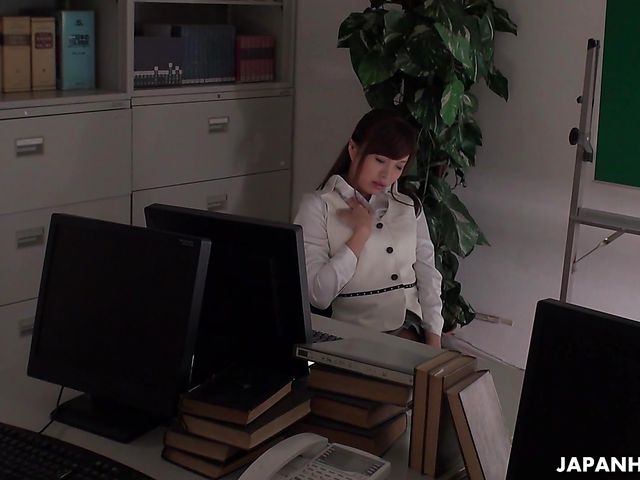 Office worker getting some juice up as her work gets boring