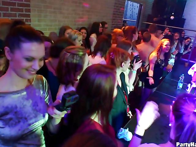 Party blowjob in the crowd in a nightclub