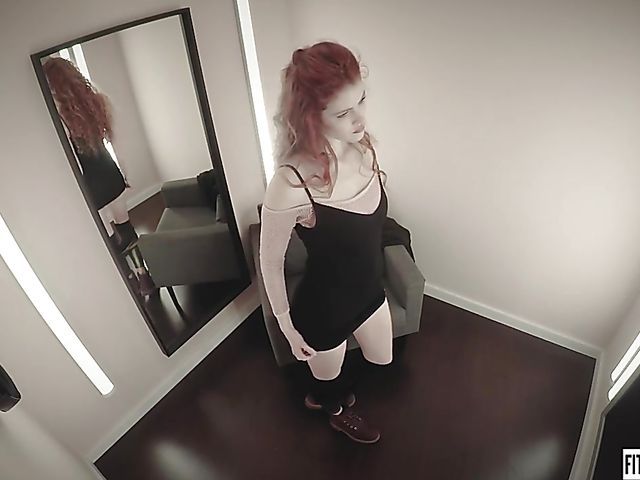 Redhead Heidi Rom plays with her pink pussy in the fitting room