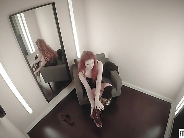 Redhead Heidi Rom plays with her pink pussy in the fitting room