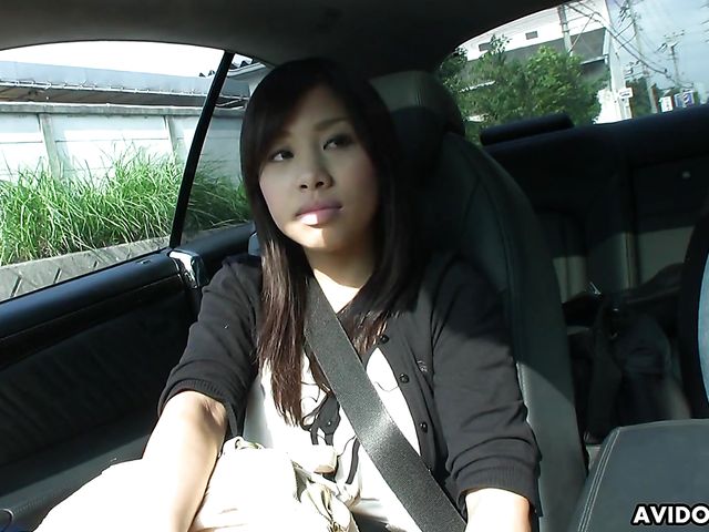 Japanese sweetie Karin Asahi gives a car blowjob 