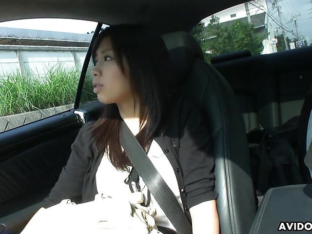 Japanese sweetie Karin Asahi gives a car blowjob 
