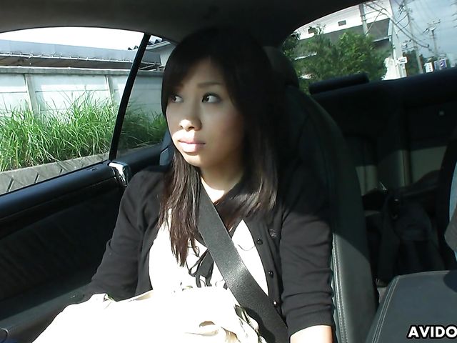 Japanese sweetie Karin Asahi gives a car blowjob 