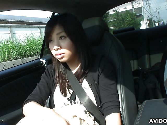 Japanese sweetie Karin Asahi gives a car blowjob 
