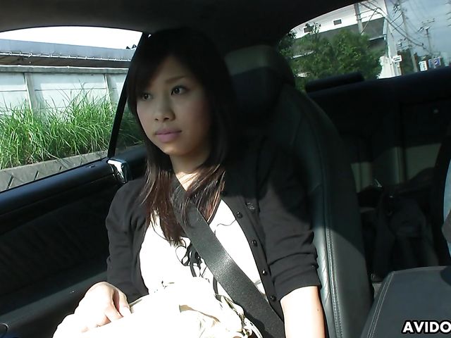 Japanese sweetie Karin Asahi gives a car blowjob 