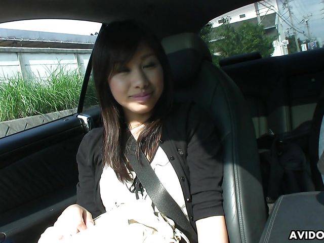 Japanese sweetie Karin Asahi gives a car blowjob 